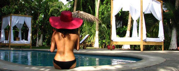 A beautiful woman enjoys the pool